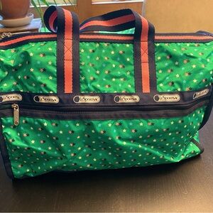 LaSportsac deluxe everyday bag. Green with pink stars.